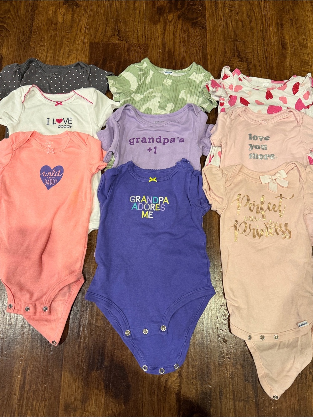 Assorted 12 month short sleeve onesies